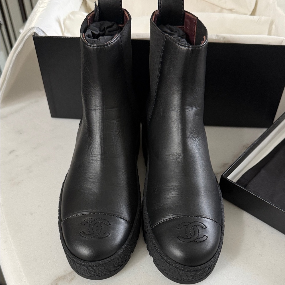 CHANEL Black Leather Boots with Embossed Logo